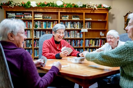Group of senior women playing cards